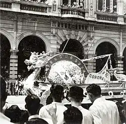 The photo shows a float numbered 17 on the street with a sign written "恭祝英女皇加冕大典(Congratulation of the Queen Coronation)" and a flag written "ERII CORONATION"