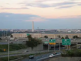 Cars on I-395, leaving Washington, D.C. (in distance) and passing by The Pentagon in Arlington