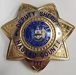 Shield worn by Nassau County deputy sheriff's (Enscribed Deputy Sheriff).