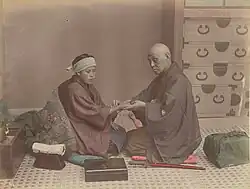 Image 5A doctor checks a patient's pulse in Meiji-era Japan. (from History of medicine)