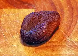 Dried apricot, with dark color due to absence of sulfur dioxide treatment