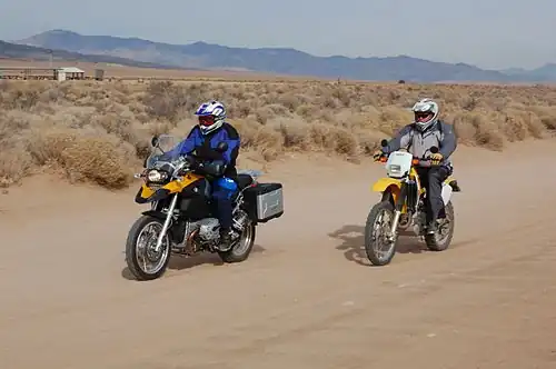 A BMW R1200GS (left) and Suzuki DR-Z400 (right), examples of adventure and dual-sport bikes.