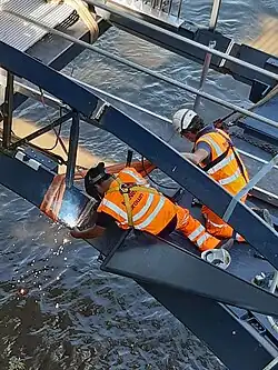 Welding ramp span to main span