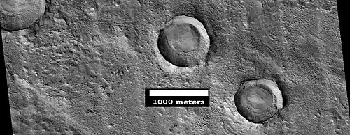 Craters with layered mounds and tall, sharp rims, as seen by HiRISE under HiWish program