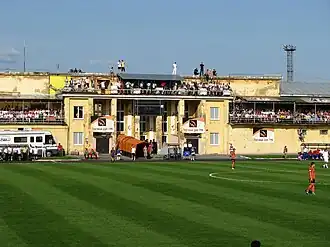 Spectators on the administrative building during the match between Ural and CSKA, July 15, 2009
