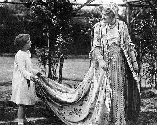 In her garden with granddaughter Nelly Gordon, c. 1918.