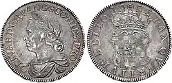 Photo of a 1658 silver Crown coin featuring Oliver Cromwell