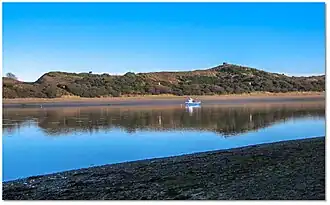 Local boat on moorings in the channel