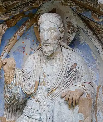 Detail of the tympanum, with traces of original colours