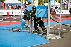 Firefighter competing in the 2024 Southeast Regional Firefighter Challenge Classic in Hoover, Alabama.
