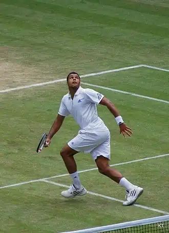 Tsonga running backwards looking to hit an overhead.
