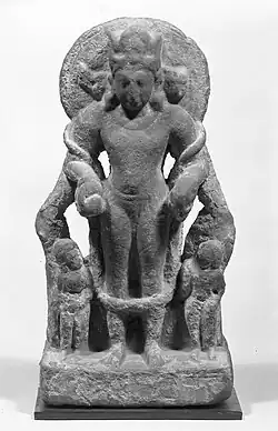 Four-faced four-armed Vishnu Vaikuntha Chaturmurti, still showing Vāsudeva Krishna as the central human figure, 4th–5th century, Mathura[68][67]