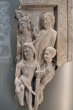 Herakles under his lion skin and holding thunder (vajra), with Buddhist monks, art of Gandhara, British Museum