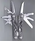 A Gerber "Suspension" multi-tool, with skeleton handle and locking blades. Blades are accessible with tool closed, and knife blades have a thumb stud for one handed opening.