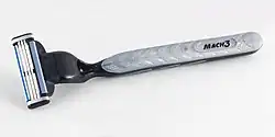A Gillette Mach3 razor handle with a blade cartridge attached