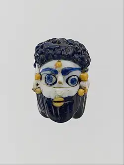 Face bead; mid-4th–3rd century BC; glass; height: 2.7&nbsp; cm; Metropolitan Museum of Art