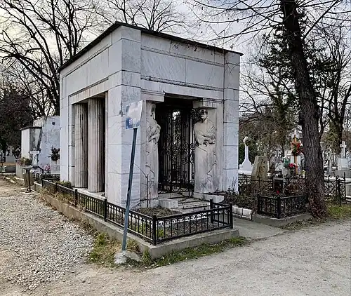 Mature - Grave of the Străjescu Family, Bellu Cemetery, Bucharest, by George Cristinel, 1934[87]