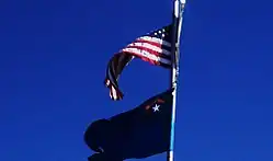 The Nevada state flag flying at the Great Basin National Park, underneath a U.S. flag.