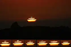 Mock mirage sunset with green flash