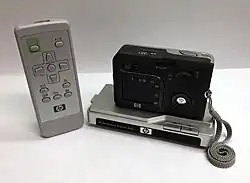 Back of HP PhotoSmart R607 with LCD display and R-Series dock with remote control