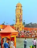 Clock Tower during evening prayers (2021 Kumbh Mela)