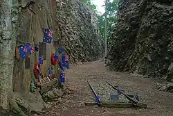 Australian and New Zealand flags left by visitors at the memorial