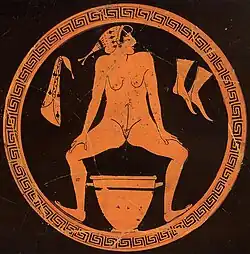 Greek hetaera urinates into skyphos (c.โ480 BCE)