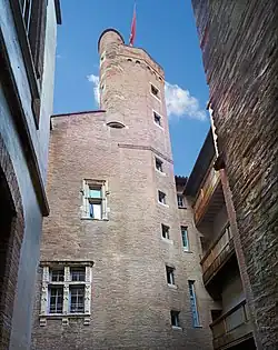Gothic tower with Renaissance window.