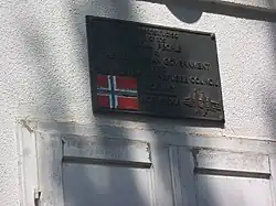 Plate marking donation from Government of Norway and Norwegian Refugee Council from 1997