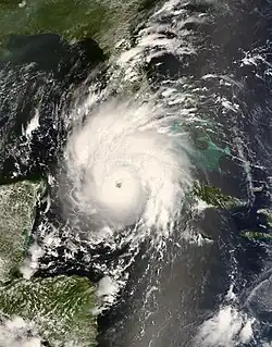 The image shows Hurricane Gustav making landfall on Cuba on August 30. An eye is visible in the center of the storm.