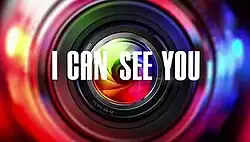 An image of a camera lens. The series title is displayed on the center of the image.