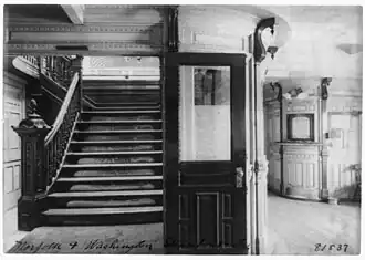 Interior view of steamboat showing stairway and pursers office