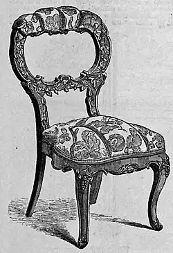Chair carved in black walnut and covered in crimson and gold damask by J. & W. Hilton