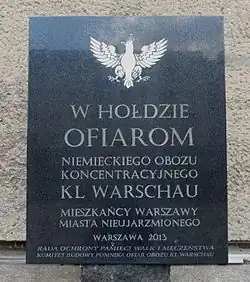 A commemorative plaque near Pawiak Prison (in Polish). It says: "In honour of the victims of the German concentration camp KL Warschau – inhabitants of Warsaw – the city that was never subdued. Warsaw 2013"