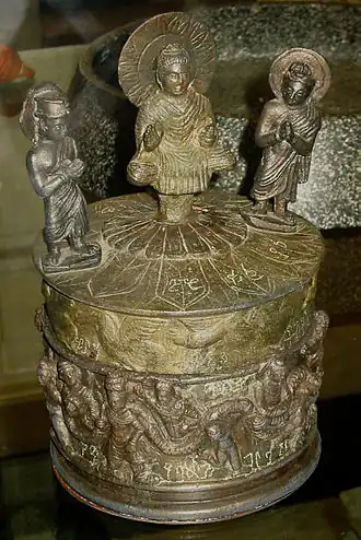 The "Kanishka casket," with the Buddha surrounded by Brahma and Indra, and Kanishka on the lower part, AD 127.