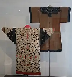 Two robes in a display.