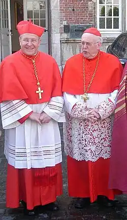 Two older white men wearing choir dress.