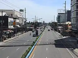 Paint-separated Class II bicycle lane along Manuel L. Quezon National Highway in Lapu-Lapu City
