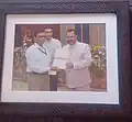 Close-up photo of Lavu Thakur receiving Certification of Award
