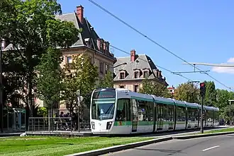 Tram on Line T3a on green track in front of the Cité Internationale Universitaire de Paris