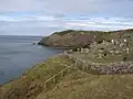 View of the graveyard at Llanbadrig church showing its position on the coast.