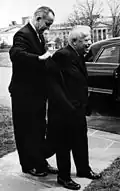 Lyndon Johnson helps Dubinsky with his coat