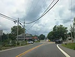 MD 58 westbound at a roundabout in the center of the community