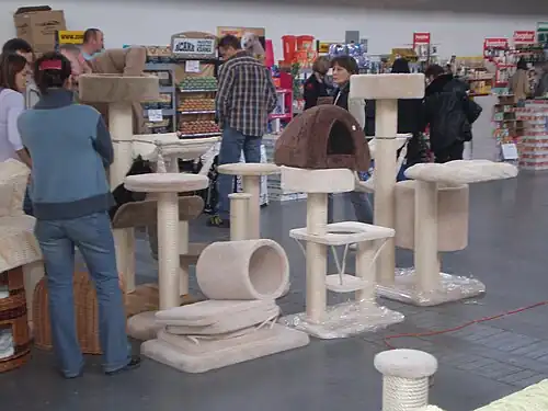 A variety of scratching posts for sale at a cat show