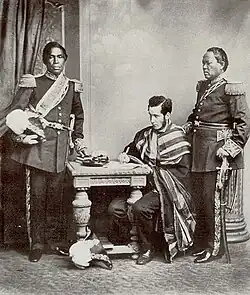 Image 8Malagasy Embassy to Europe in 1863. Left to right: Rainifiringa Ralaimaholy, Rev. John Duffus and Rasatranabo aka Rainandrianandraina. (from History of Madagascar)