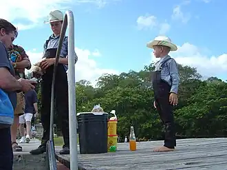 Two plain dressed Old Colony Mennonite boys near Lamanai in Belize