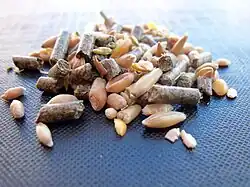 Mix of seed and manufactured pellets for animal feed