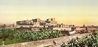 Photograph of the ruins of Mohamedia, Tunisia, including Mohamedia Palace. This color photochrome print was made in 1899 in Tunis, Tunisia.