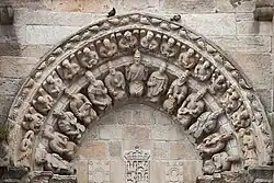 Circa 1434, Spain. Jesus Christ surrounded by twelve men with instruments and wearing crowns, above the main entrance of the Church of San Martiño de Noia.