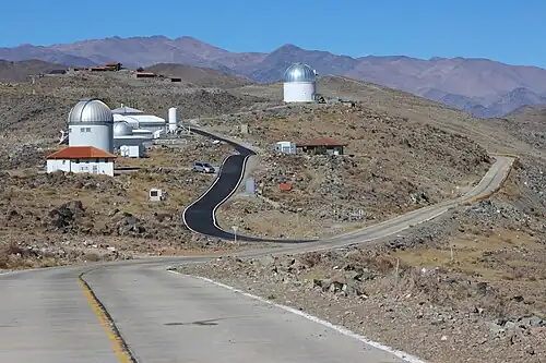 View on the OGLE telescope (in the foreground on the left) and Swope Telescope (in the background above the center)
